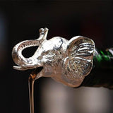 Bec verseur<br>Tête d’Éléphant - Queue de Coq